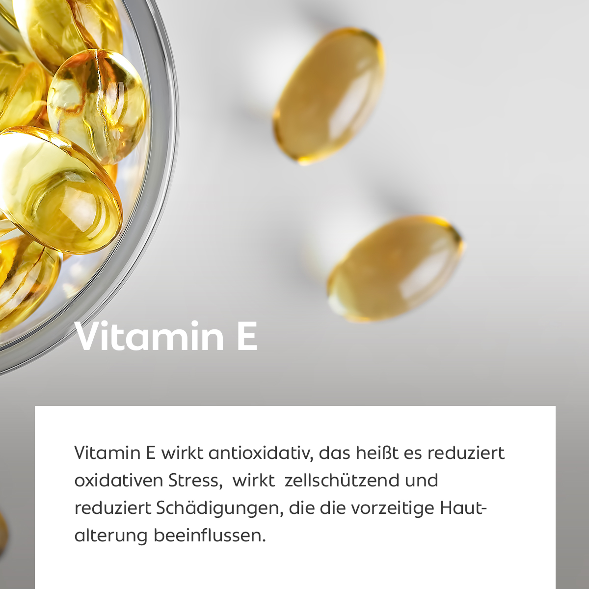 Goldene Vitamin-E-Kapseln, Symbol für antioxidativen und zellschützenden Hautschutz